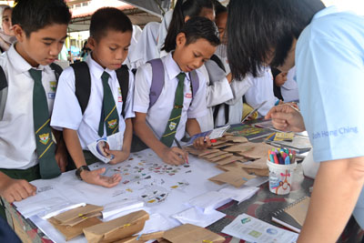 School students taking part in ecosystem mapping activities at BC MY booth during Abdul Rahim Secondary School Convocation Ceremony